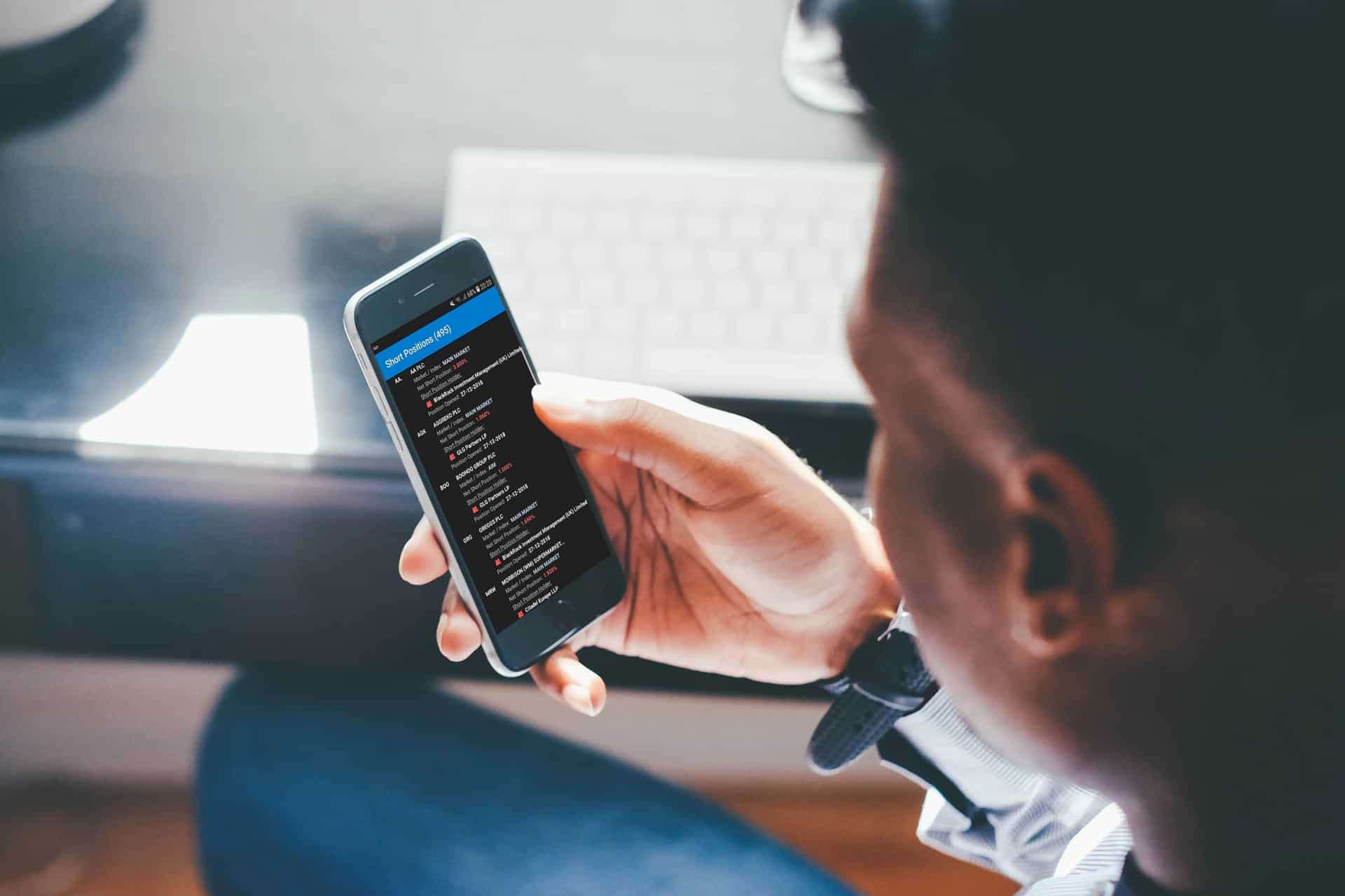 Share Talk mobile app held in a hand