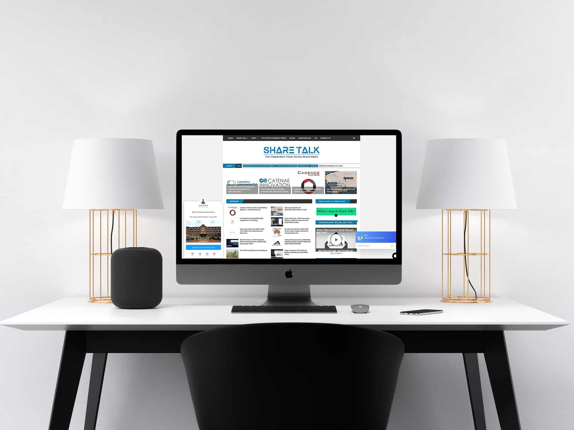 Share-Talk.com news platform on a desktop iMac